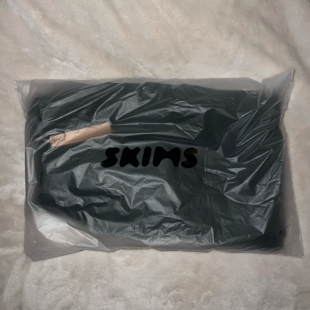 Skims dark green sweats flared